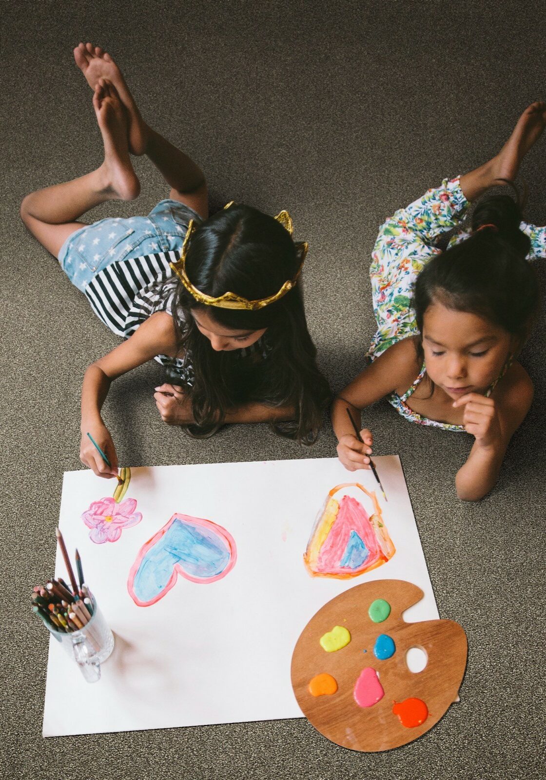 Kids drawing laying on carpet | Sotheby Floors