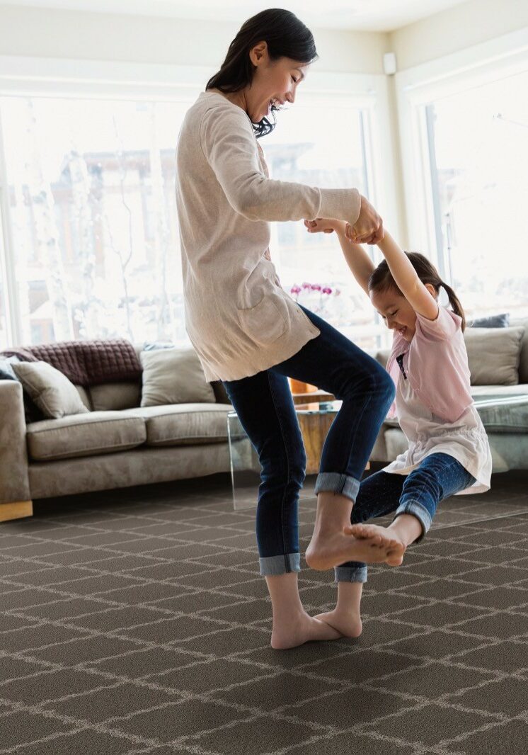 Baby girl playing with mom | Sotheby Floors